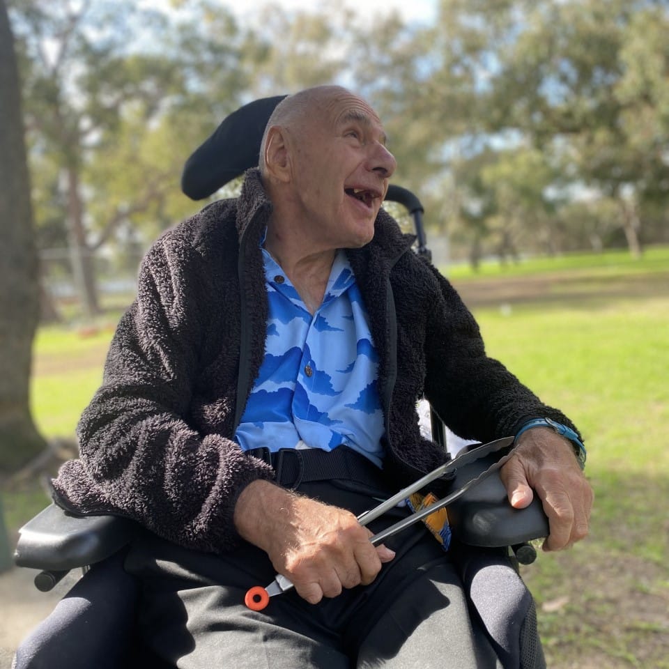 a man in a wheelchair in a park