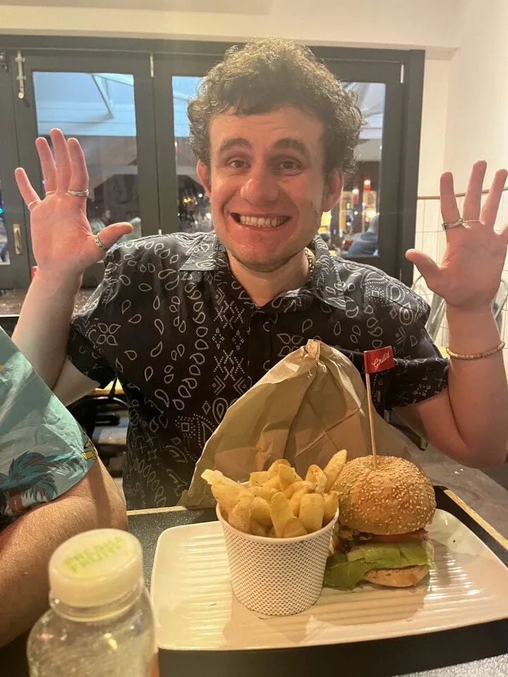 Young man excited at the dinner table